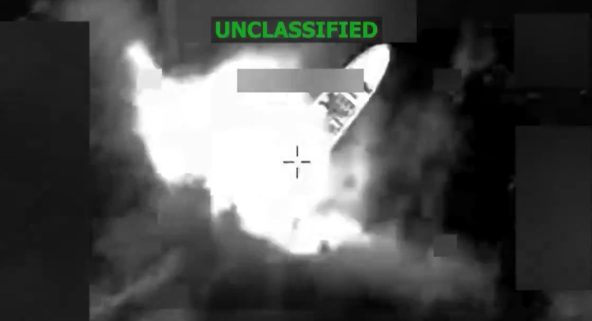 Military drone footage capturing an explosion during a tactical operation, labeled as unclassified.