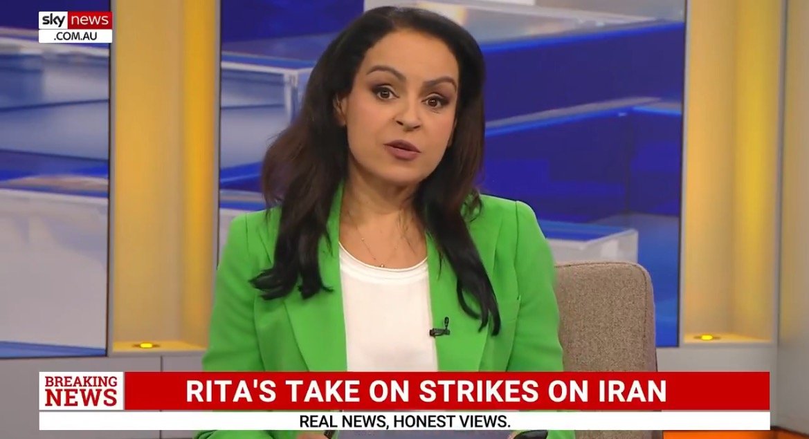 News anchor discusses recent strikes on Iran during a segment on Sky News Australia, wearing a green blazer and seated in a modern studio setting.