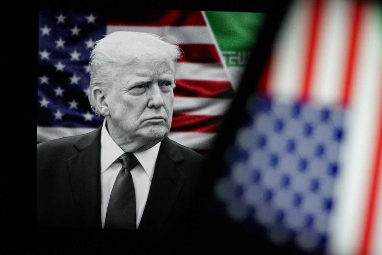 Black and white image of Donald Trump with American flags in the background, symbolizing political themes and national identity.